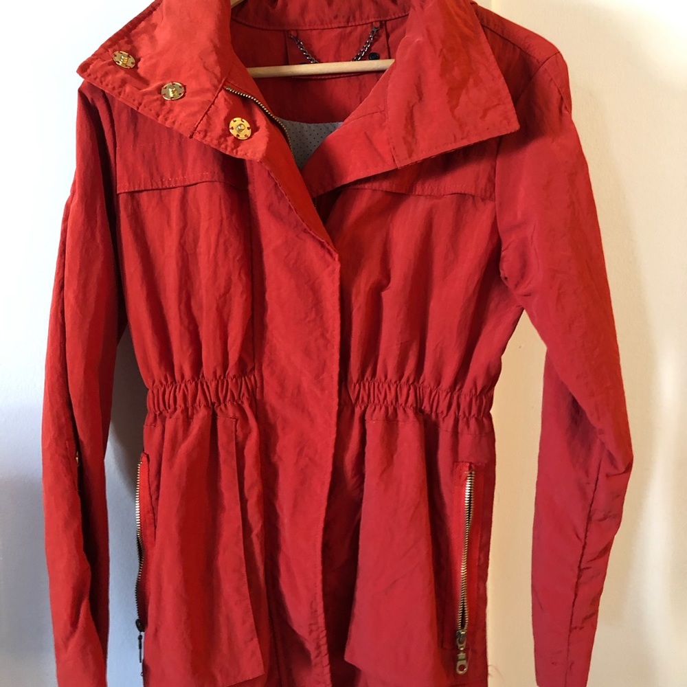 Raincoat, burnt orange-red, gold snaps & zippers
